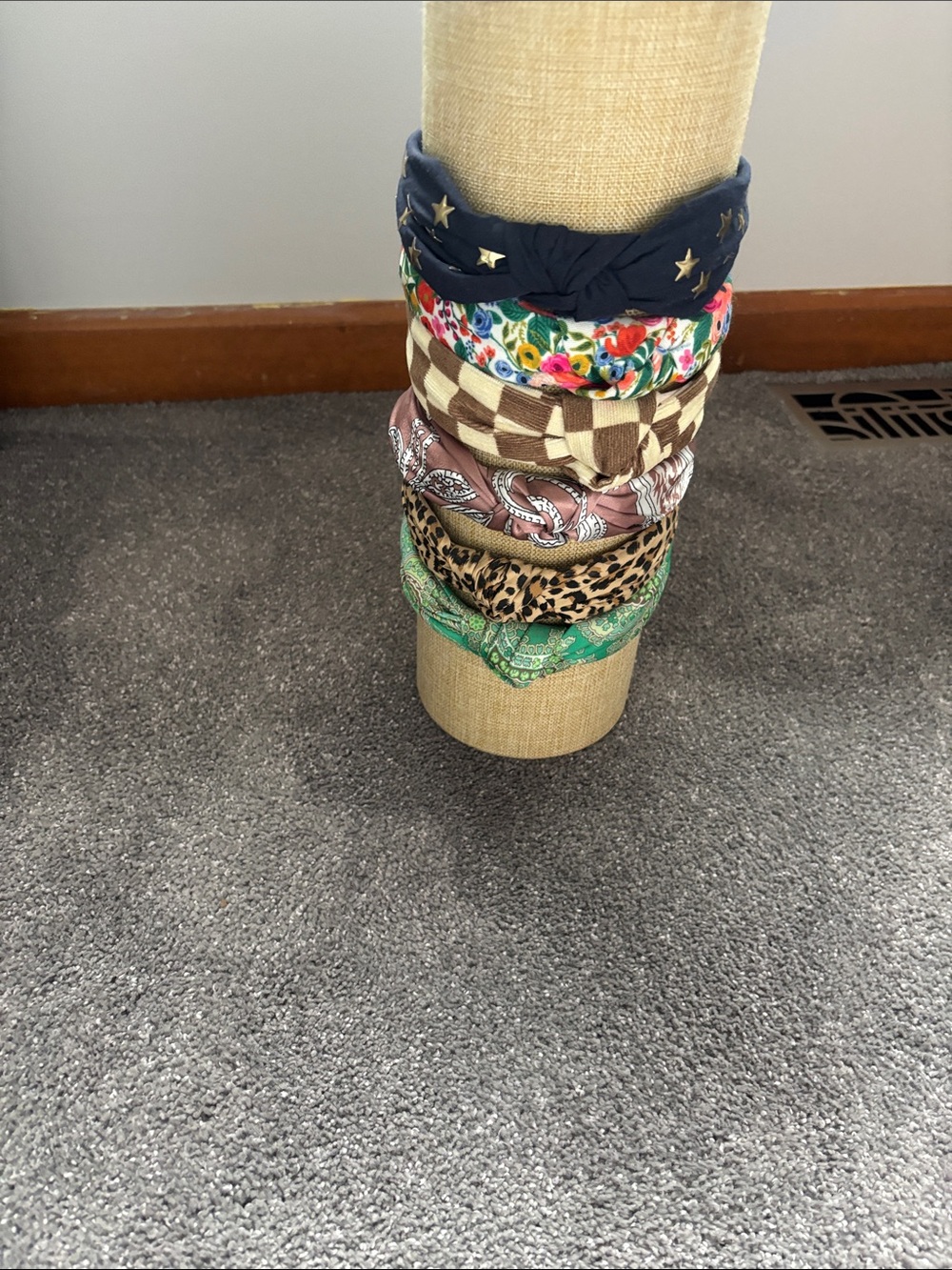 Fabric Head Band Holder including six assorted headbands.